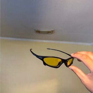 Sleek Black Frame Sunglasses with Yellow Lenses Oakley Oakleys